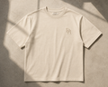 Foundation Tee in bone, front view with embroidered DH monogram