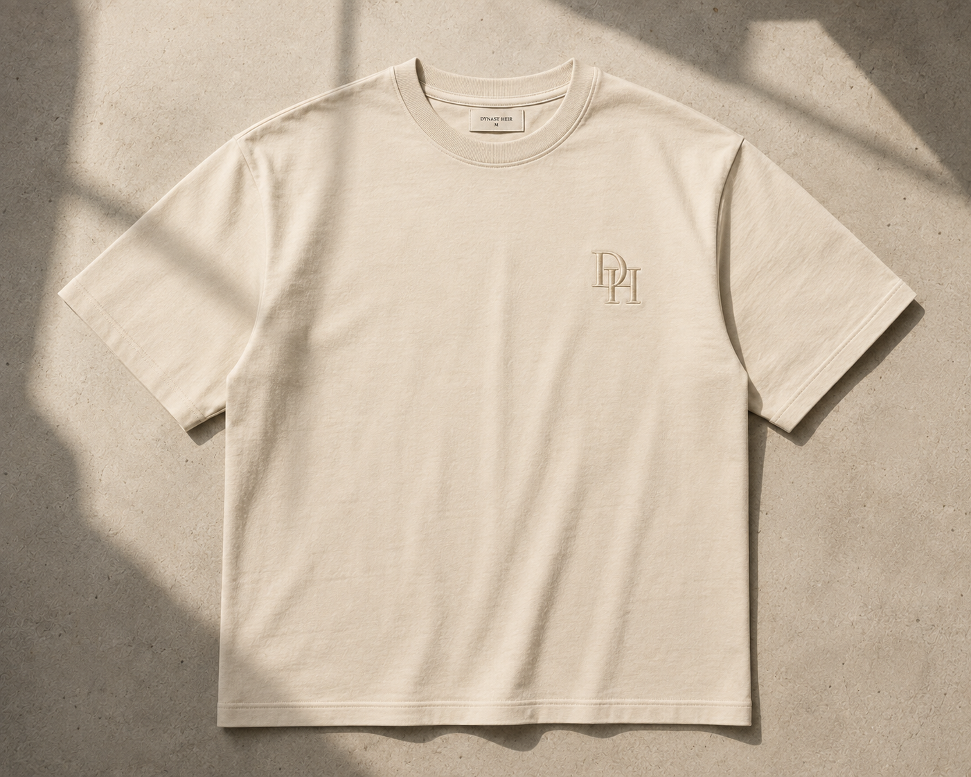 Foundation Tee in bone, front view with embroidered DH monogram